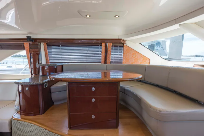Slide: The Image of Luxurious interior of 2008 Sea Ray 58 Sedan Bridge yacht with elegant seating and table. - 36