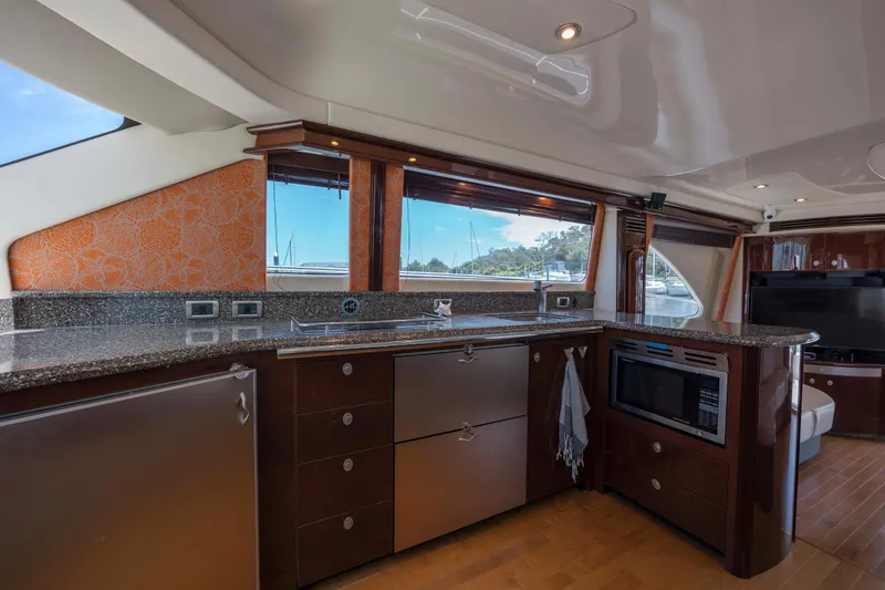 Slide: The Image of Luxurious kitchen interior of 2008 Sea Ray 58 Sedan Bridge yacht with modern appliances. - 38