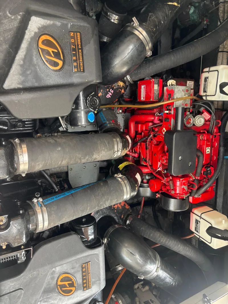 Slide: The Image of Engine compartment of a 2000 Sea Ray 310 Sundancer boat, featuring Horizon components. - 16