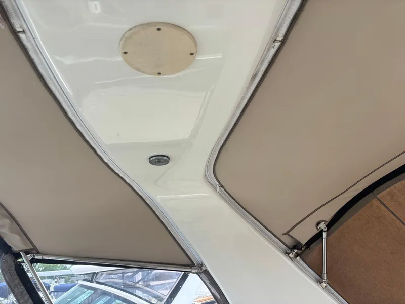 Slide: The Image of Interior view of a 2000 Sea Ray 310 Sundancer boat ceiling and fittings. - 22
