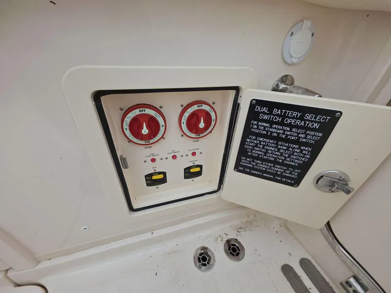 Slide: The Image of 2024 Grady-White Marlin 300 dual battery switch panel with operation instructions. - 19
