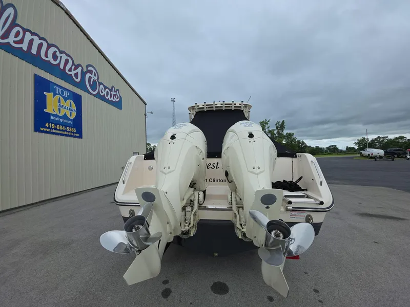 Slide: The Image of 2024 Grady-White Marlin 300 boat with dual outboard engines at Clemons Boats dealership. - 21