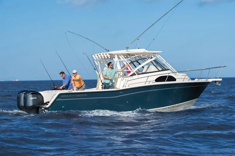 Slide: The Image of Manufacturer Provided Image: 2024 Grady-White Marlin 300 fishing boat on the water with three people. - 22