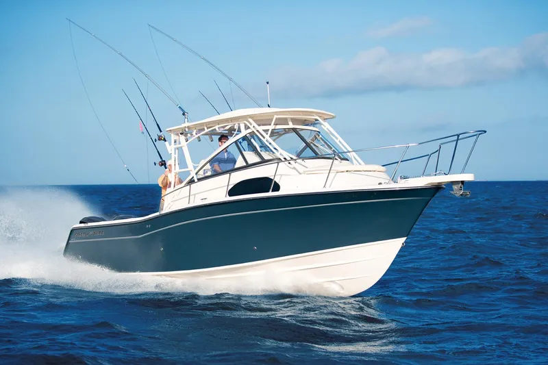 Slide: The Image of Manufacturer Provided Image: 2024 Grady-White Marlin 300 boat cruising on open water. - 23