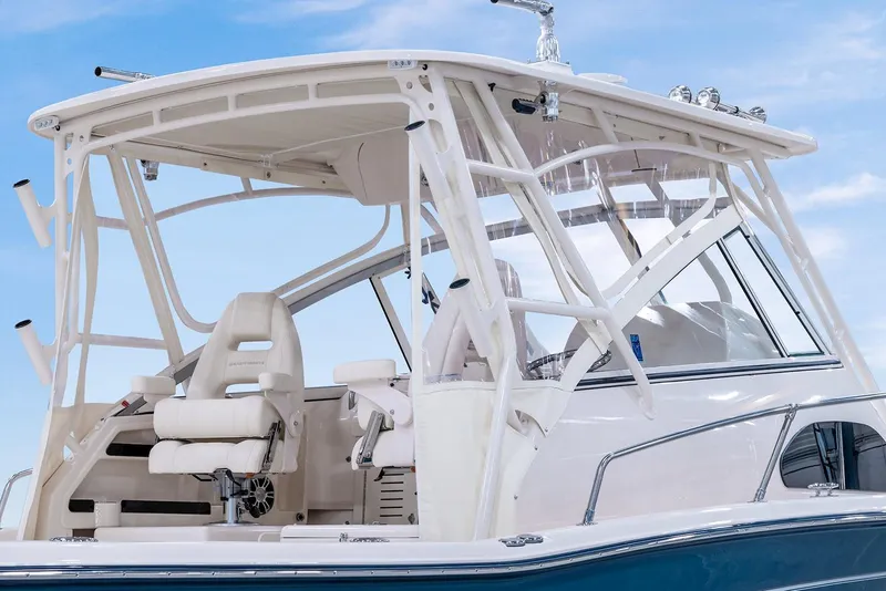 Slide: The Image of Manufacturer Provided Image: 2024 Grady-White Marlin 300 boat with white seating and blue hull. - 26