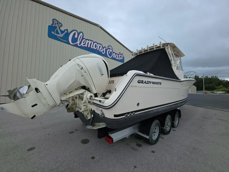 Slide: The Image of 2024 Grady-White Marlin 300 boat on trailer at Clemons Boats dealership. - 4