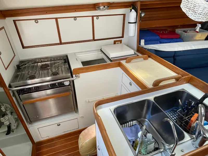 Slide: The Image of Interior of 1994 J Boats J 40 yacht kitchen with stove, sink, and storage. - 15