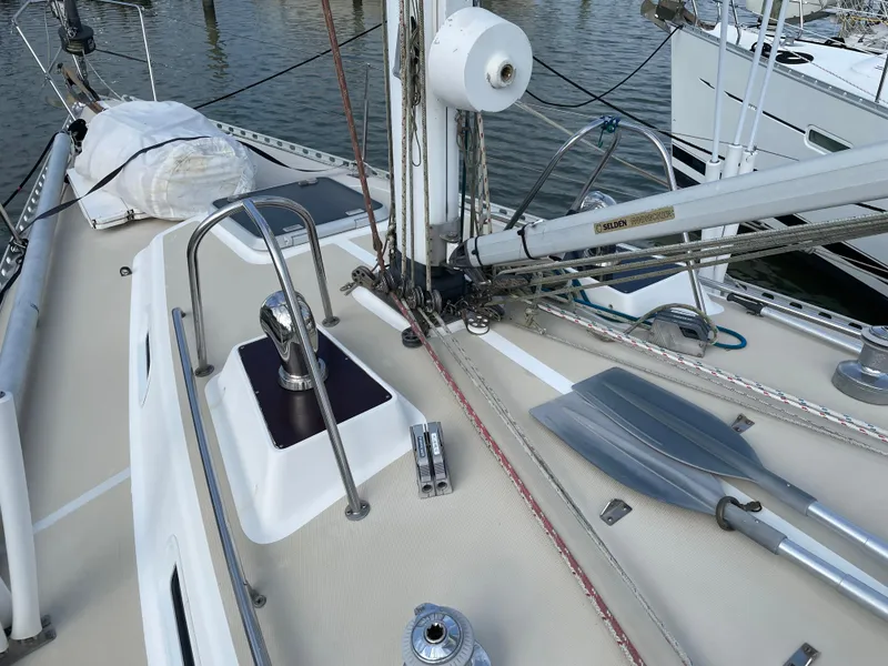 Slide: The Image of Deck of 1994 J Boats J 40 sailboat with rigging and oars visible. - 2