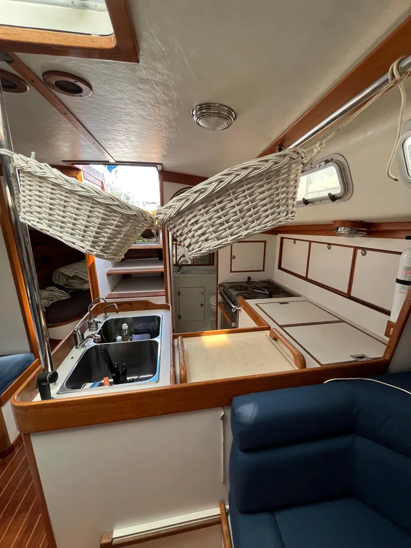 Slide: The Image of Interior of 1994 J Boats J 40 sailboat with kitchen and seating area. - 24