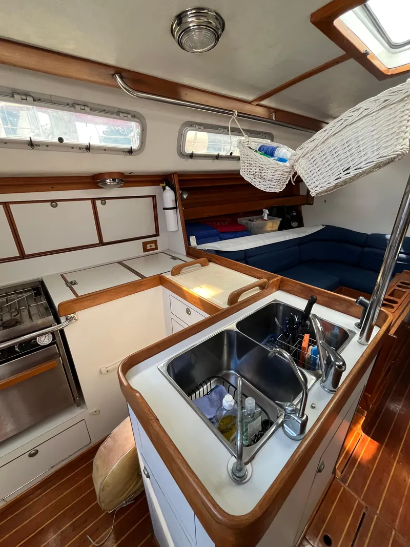 Slide: The Image of Interior of 1994 J Boats J 40 sailboat with kitchen and seating area. - 29