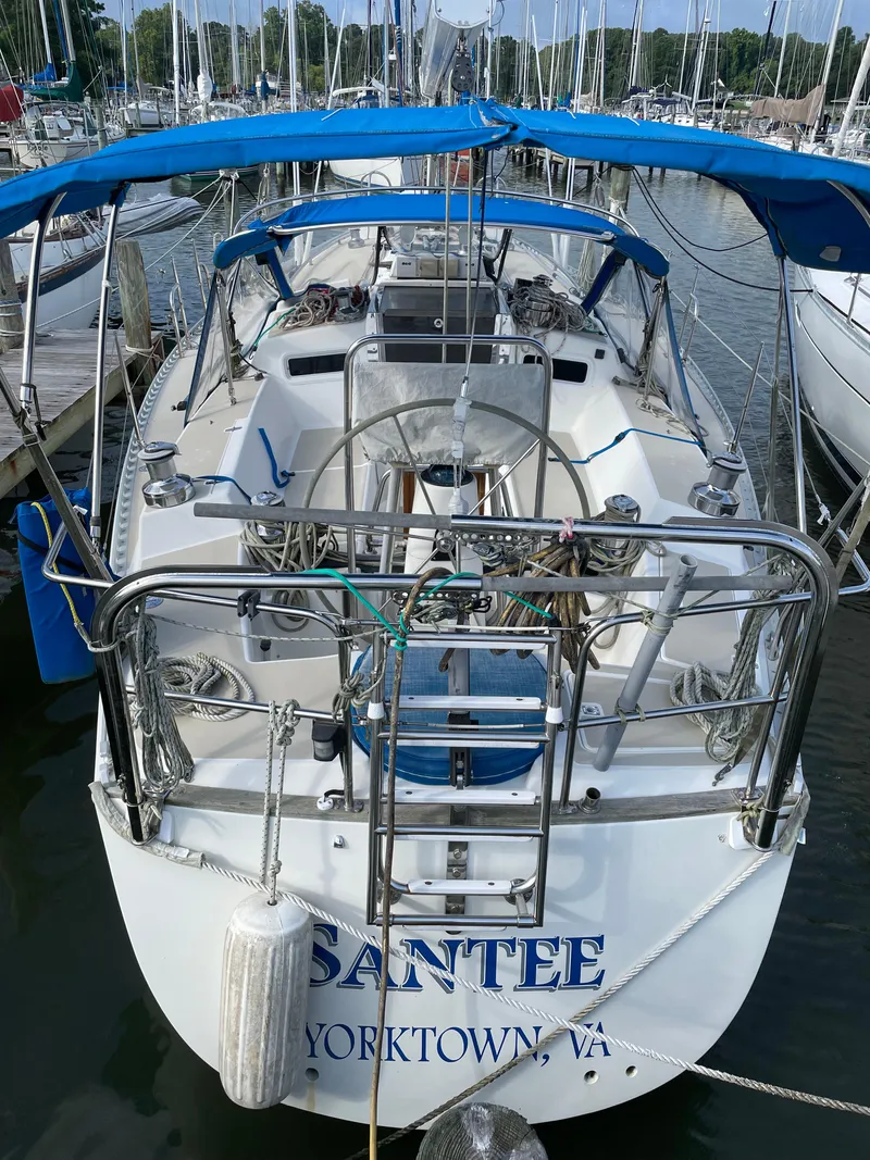 Slide: The Image of 1994 J Boats J 40 sailboat docked, featuring blue canopy and Yorktown, VA registration. - 3