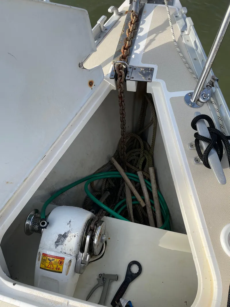 Slide: The Image of Anchor locker of a 1994 J Boats J 40 sailboat with ropes and tools. - 34
