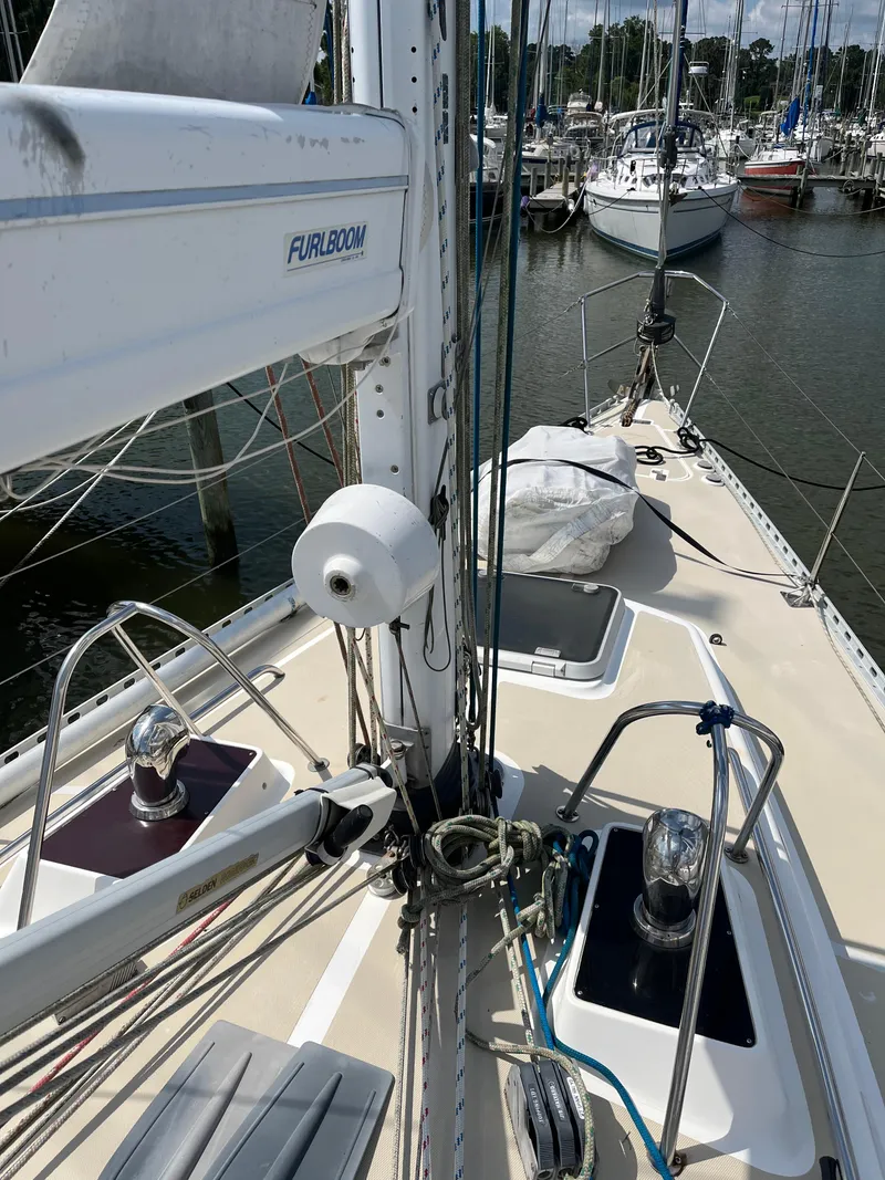 Slide: The Image of 1994 J Boats J 40 sailboat deck with rigging and winches in marina. - 6