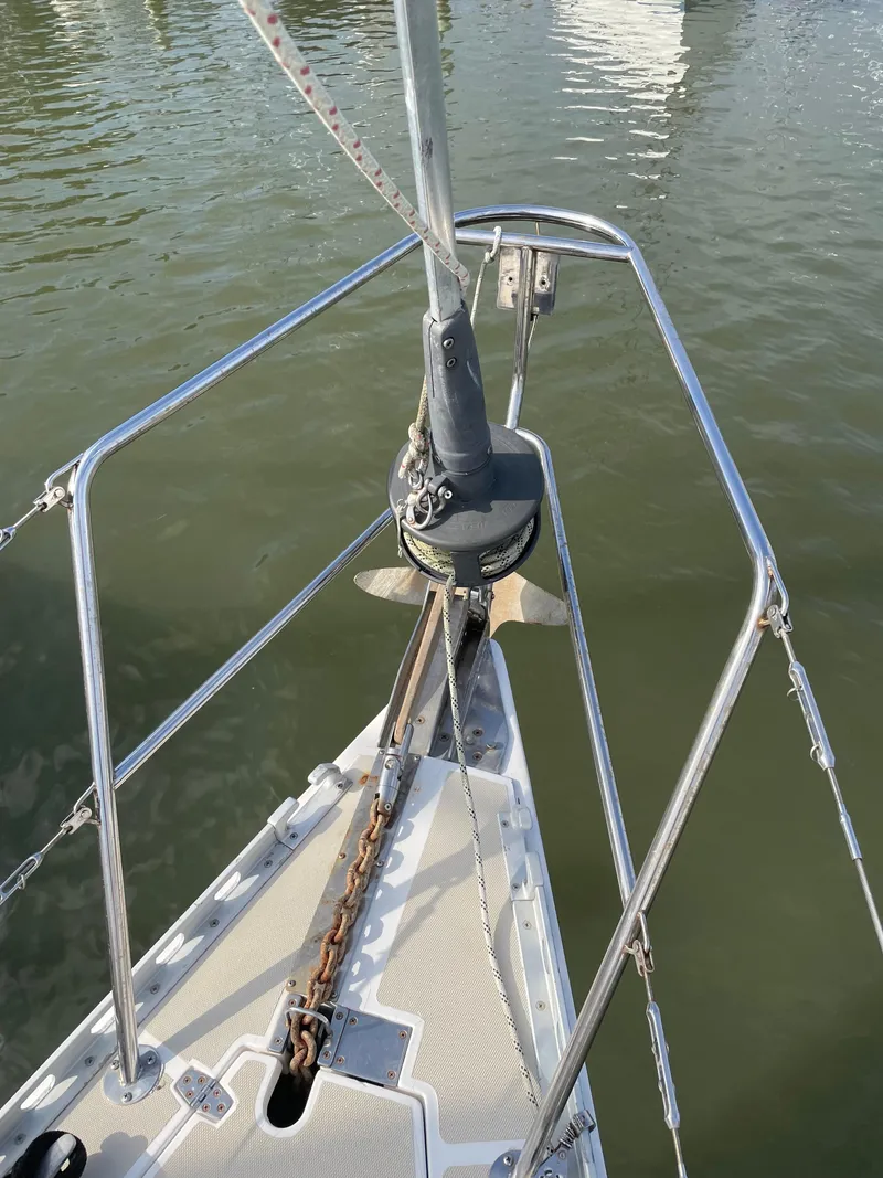 Slide: The Image of Bow of 1994 J Boats J 40 sailboat with anchor and chain in water. - 7
