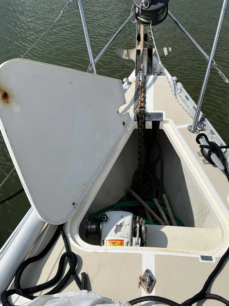 Slide: The Image of Anchor locker of a 1994 J Boats J 40 sailboat with open hatch and visible chain. - 8