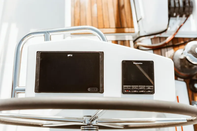 Slide: The Image of Steering console of 2024 Beneteau Oceanis 46.1 yacht with navigation instruments. - 6