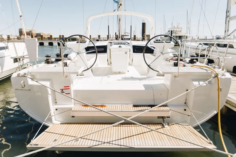 Slide: The Image of 2024 Beneteau Oceanis 51.1 yacht docked at marina, rear view. - 4