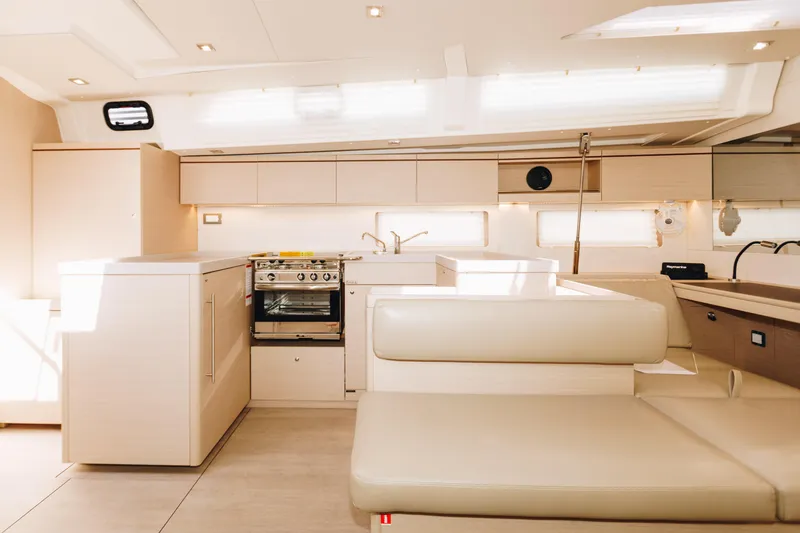 Slide: The Image of Luxurious interior of 2024 Beneteau Oceanis 51.1 yacht with modern kitchen and seating area. - 7