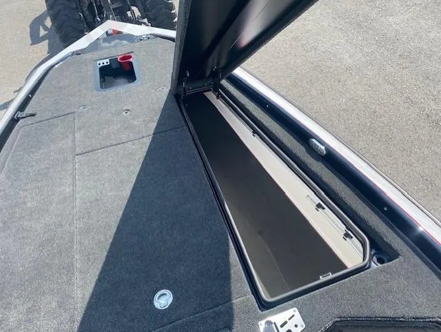 Slide: The Image of Open storage compartment on 2026 Bullet 21XST boat deck. - 11
