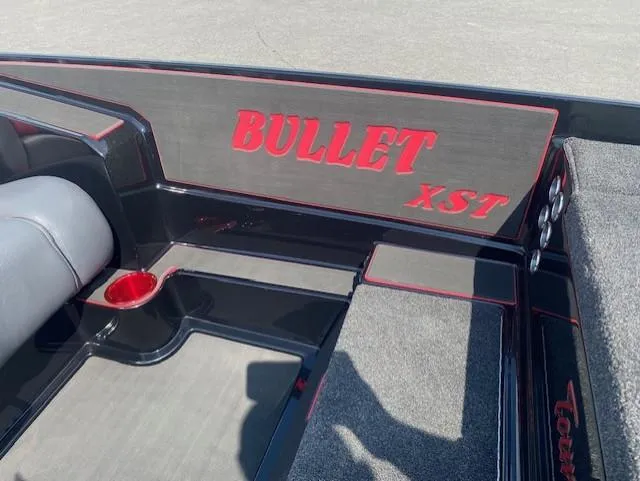 Slide: The Image of Interior of 2026 Bullet 21XST boat with red and black design accents. - 14