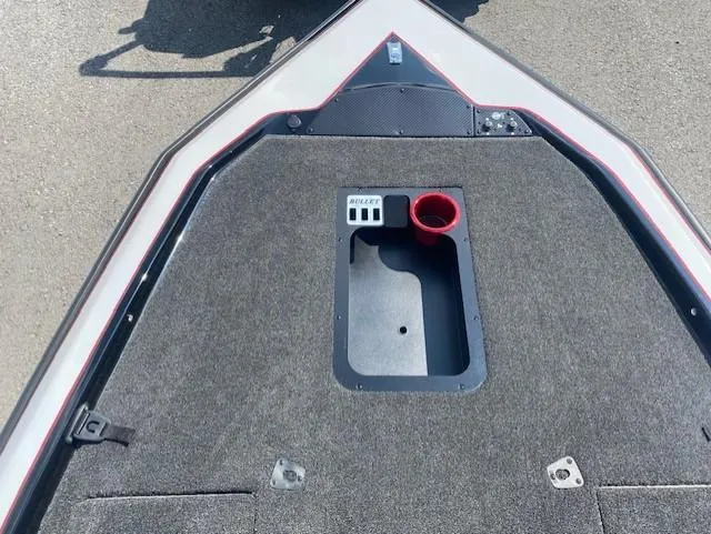 Slide: The Image of Bow of 2026 Bullet 21XST boat with carpeted deck and storage compartment. - 15
