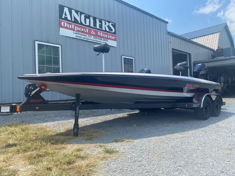 Slide: The Image of 2026 Bullet 21XST boat on trailer at Anglers Outpost & Marine. - 2