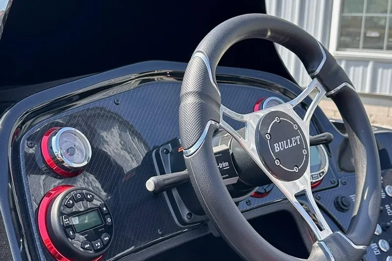 Slide: The Image of Steering wheel and dashboard of 2026 Bullet 21XST boat with modern controls. - 20