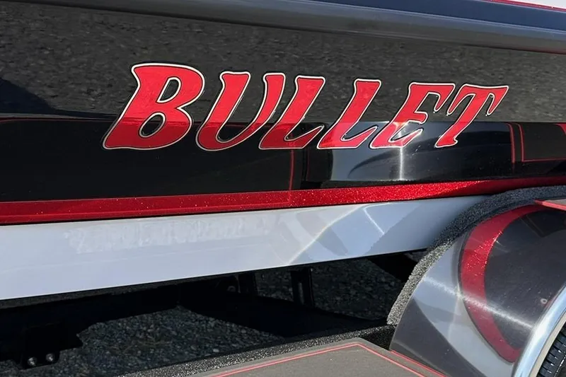 Slide: The Image of 2026 Bullet 21XST boat with bold red logo on sleek black surface. - 3