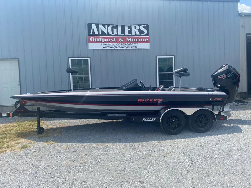 Slide: The Image of 2026 Bullet 21XST boat on trailer at Anglers Outpost & Marine dealership. - 5