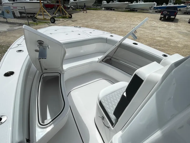 Slide: The Image of 2026 Blackfin 262 HB boat interior with open storage compartments and seating. - 12
