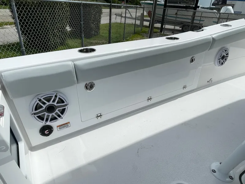 Slide: The Image of 2026 Blackfin 262 HB boat interior with speakers and storage compartments. - 23