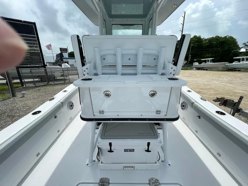 Slide: The Image of 2026 Blackfin 262 HB boat interior with storage and Yeti cooler. - 31