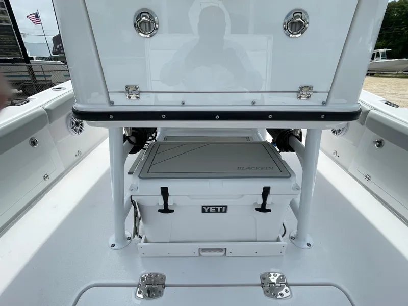 Slide: The Image of 2026 Blackfin 262 HB boat deck with Yeti cooler and storage compartment. - 32