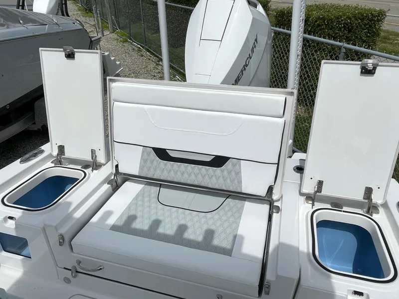 Slide: The Image of 2026 Blackfin 262 HB boat with open storage compartments and seating area. - 34