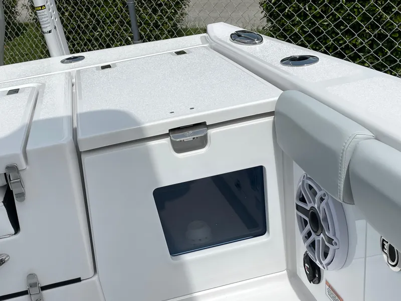 Slide: The Image of 2026 Blackfin 262 HB boat interior with storage compartments and speaker. - 35