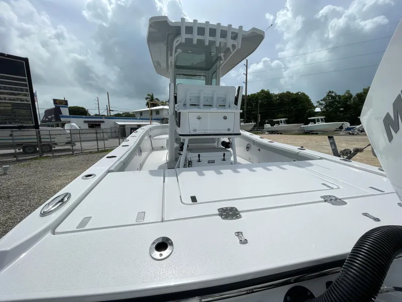 Slide: The Image of 2026 Blackfin 262 HB boat with spacious deck and modern design under cloudy sky. - 37