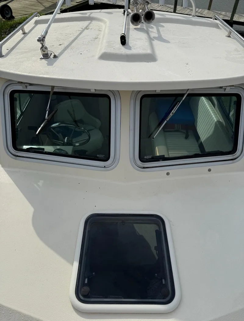 Slide: The Image of 2013 Parker 2120 SC boat cabin with dual windows and roof hatch. - 10