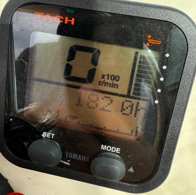 Slide: The Image of Yamaha tachometer display on a 2013 Parker 2120 SC boat showing 0 RPM. - 8