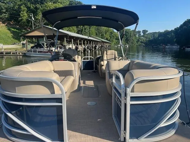 Slide: The Image of 2022 Sun Tracker Party Barge 22 XP3 pontoon boat docked on a serene lake. - 15