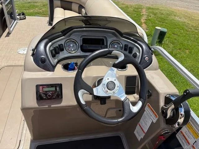 Slide: The Image of 2022 Sun Tracker Party Barge 22 XP3 dashboard with steering wheel and controls. - 7