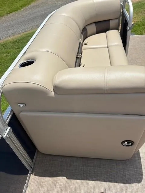 Slide: The Image of 2022 Sun Tracker Party Barge 22 XP3 beige seating with cup holder on pontoon boat. - 8