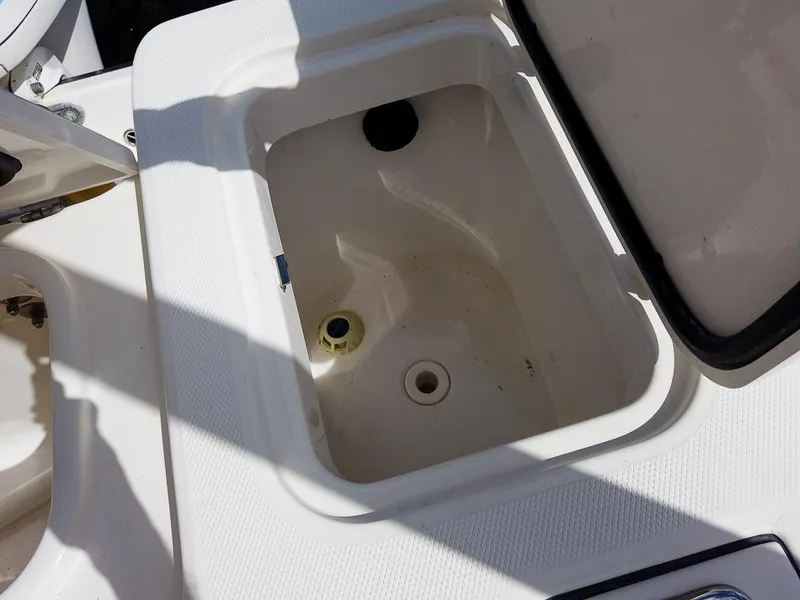Slide: The Image of Open storage compartment on a 2015 Edgewater 320CC boat. - 22