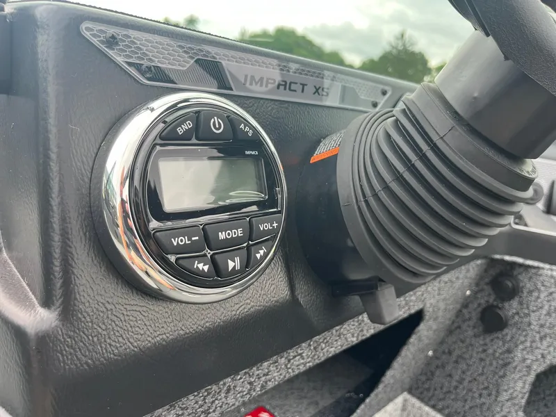 Slide: The Image of 2026 Lund 1775 Impact XS Sport dashboard with control panel and steering wheel detail. - 27