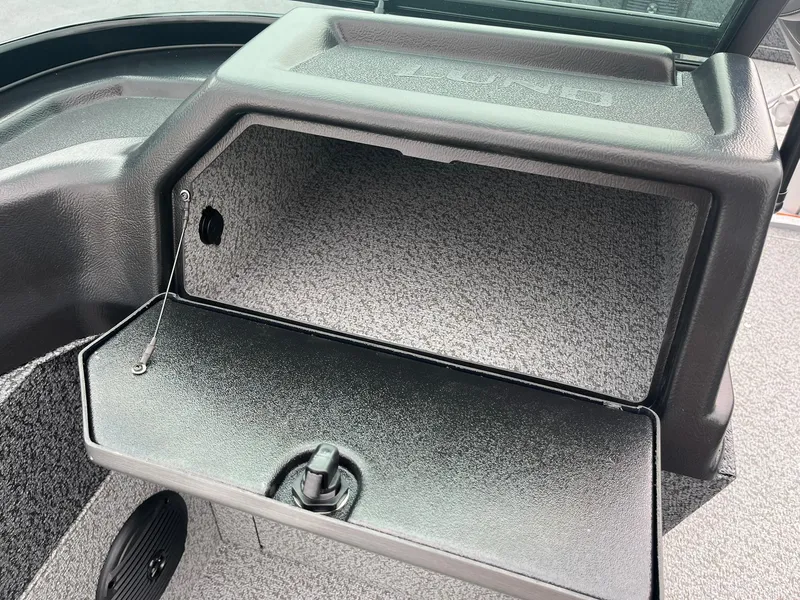 Slide: The Image of Open storage compartment in 2026 Lund 1775 Impact XS Sport boat. - 29