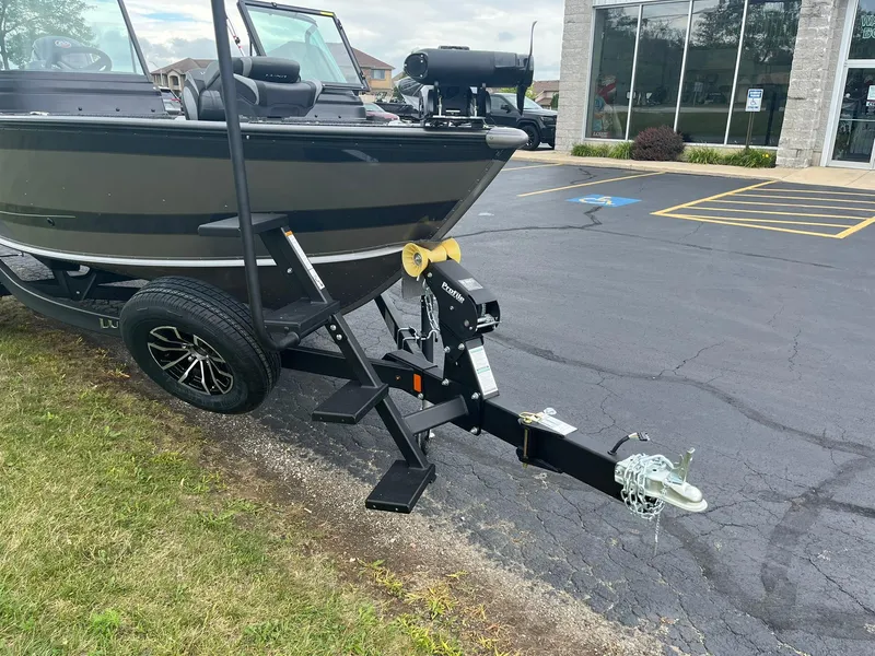 Slide: The Image of 2026 Lund 1775 Impact XS Sport boat on trailer in parking lot. - 3