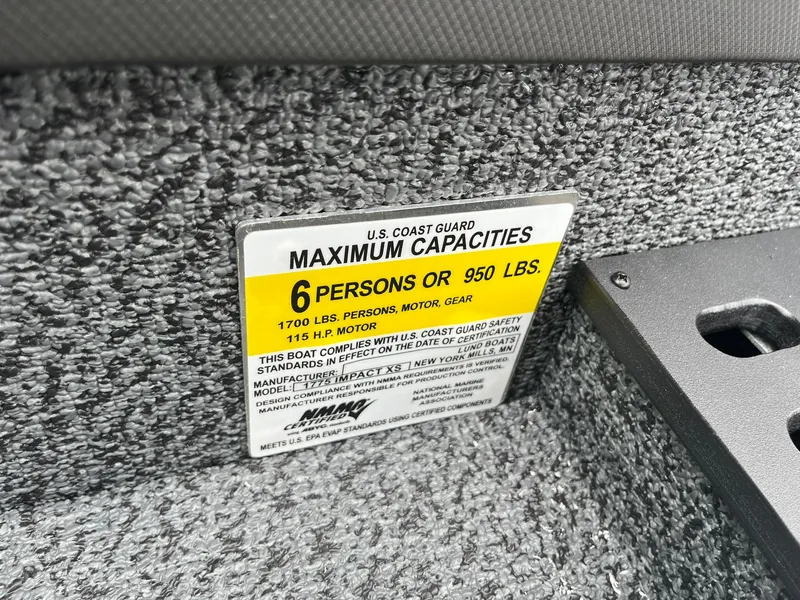 Slide: The Image of 2026 Lund 1775 Impact XS Sport boat capacity label, 6 persons or 950 lbs, 115 HP motor. - 31