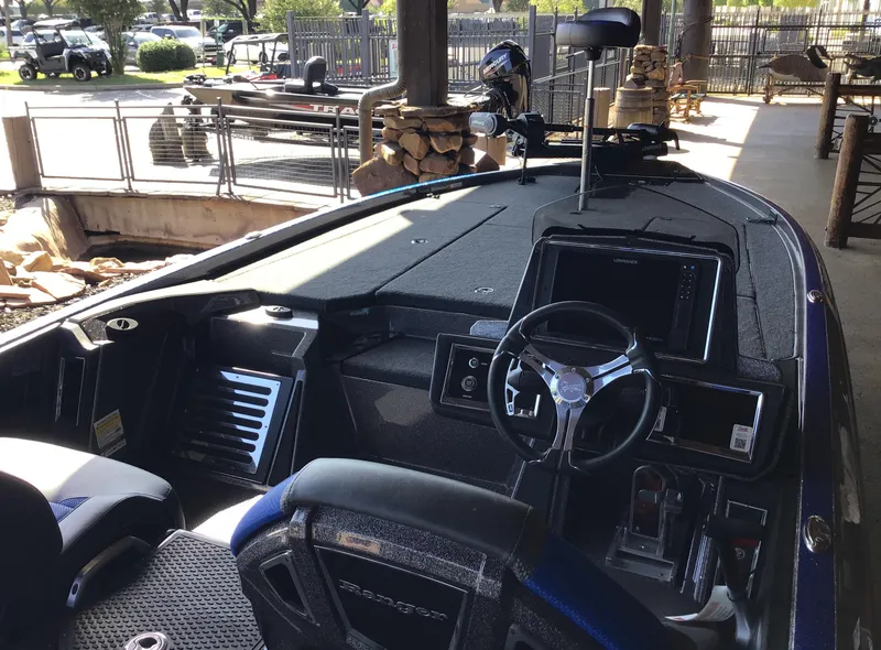 Slide: The Image of 2024 Ranger Z521R Ranger Cup Equipped boat interior with steering wheel and dashboard. - 2