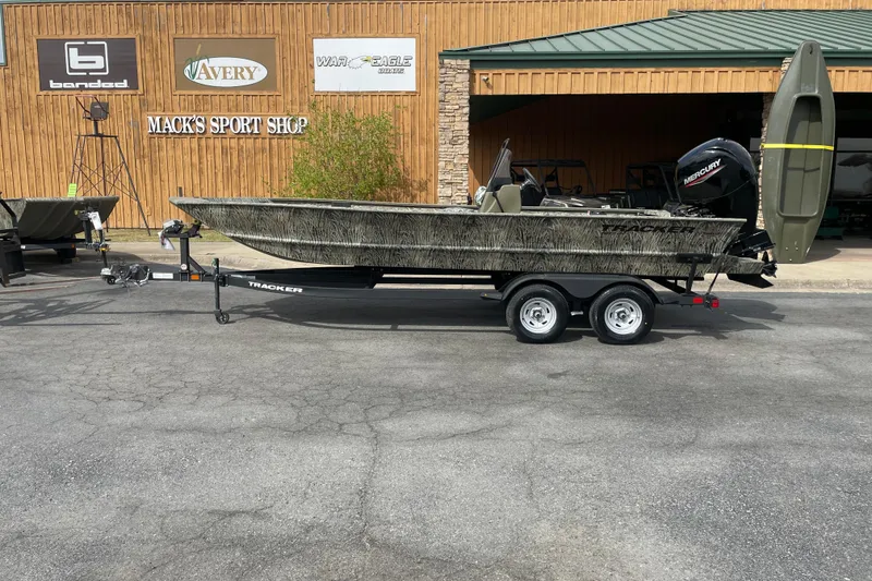 The Image of 2025 Tracker Grizzly 2072 CC boat on trailer outside Mack's Sport Shop. - 0