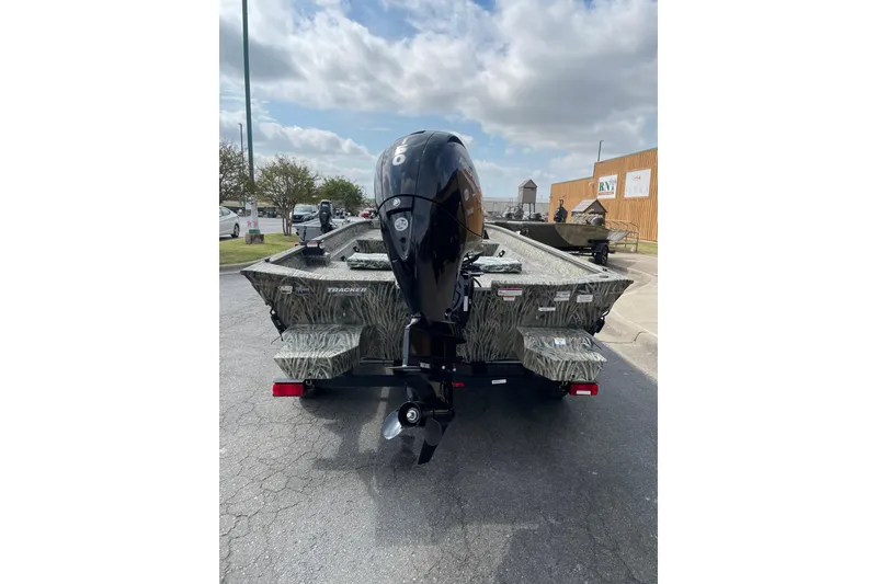 Slide: The Image of 2025 Tracker Grizzly 2072 CC boat with camouflage design and powerful outboard motor. - 6