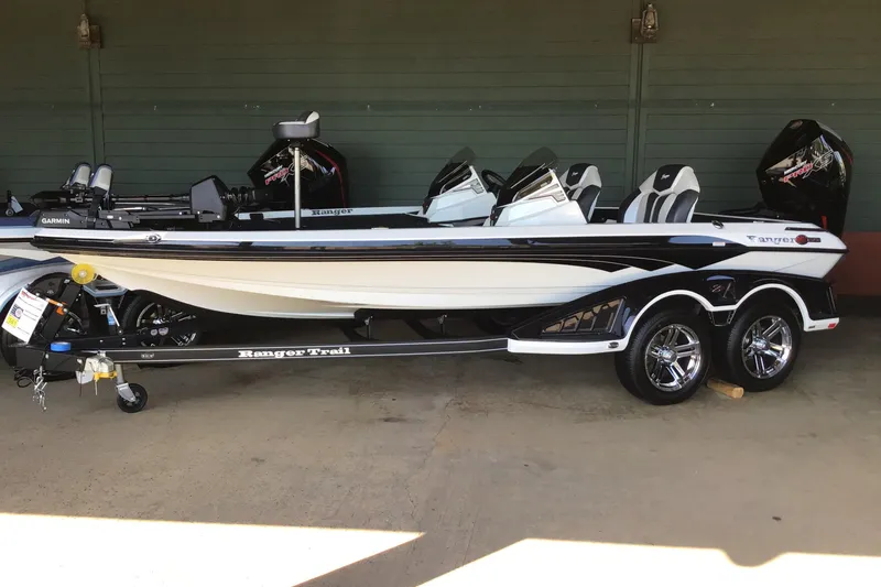 The Image of 2025 Ranger Z519R Cup-Equipped boat on trailer, sleek design, dual seats, and modern features. - 0